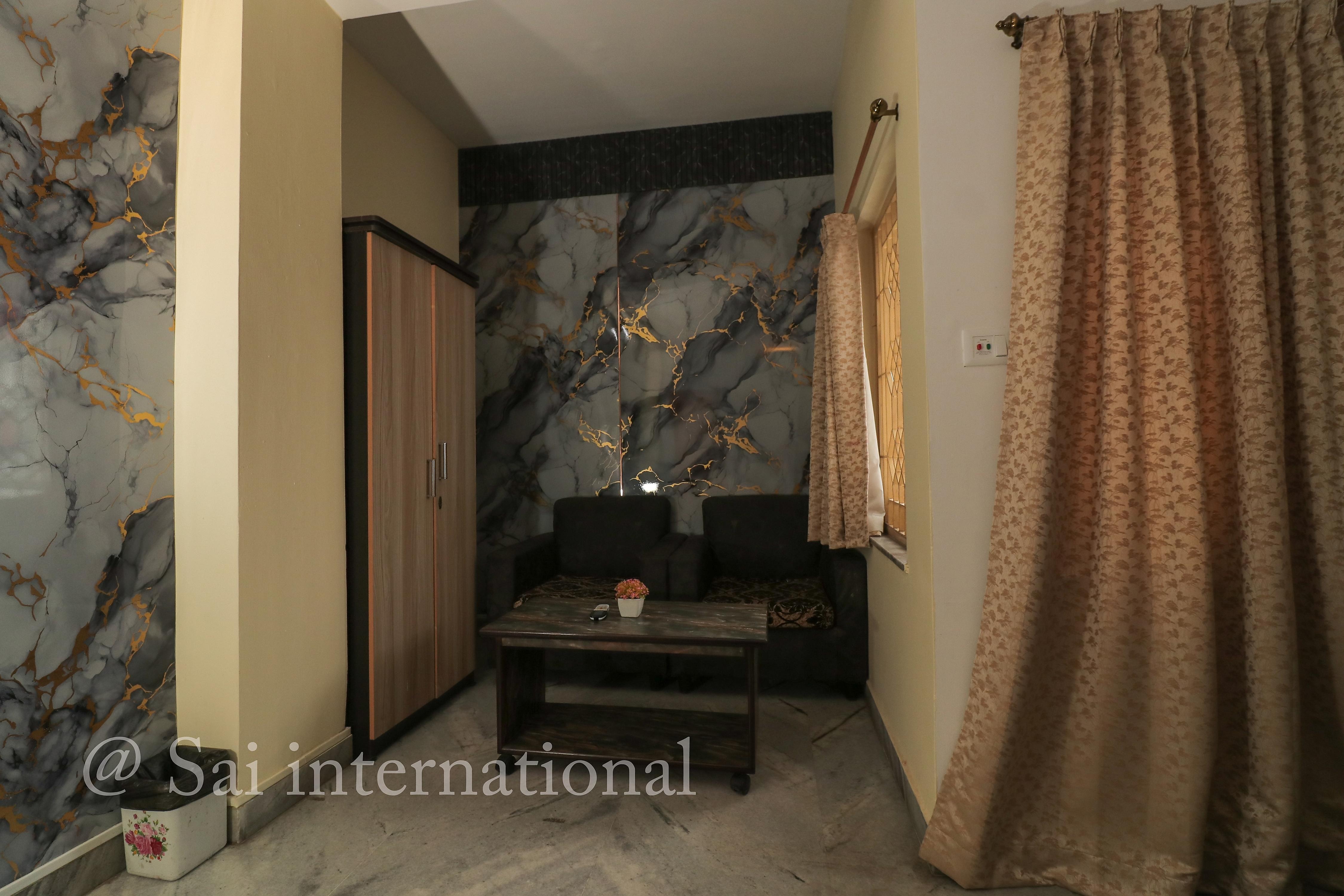 Sai International Guest House - Tap to explore photos