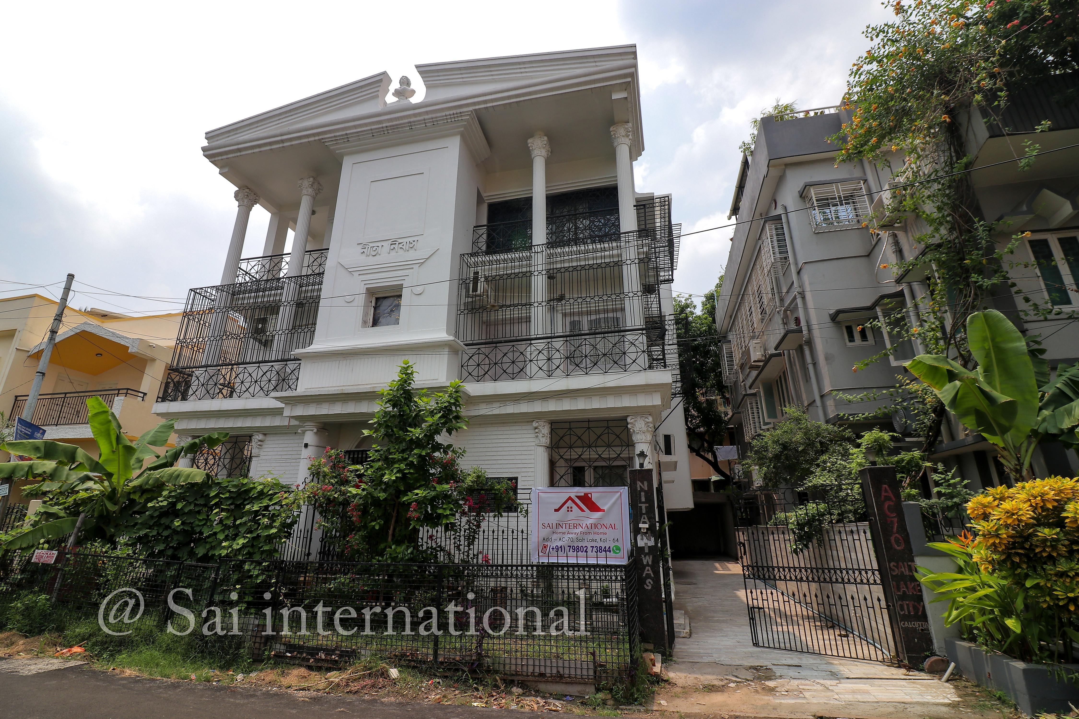 Sai International Guest House - Tap to explore photos