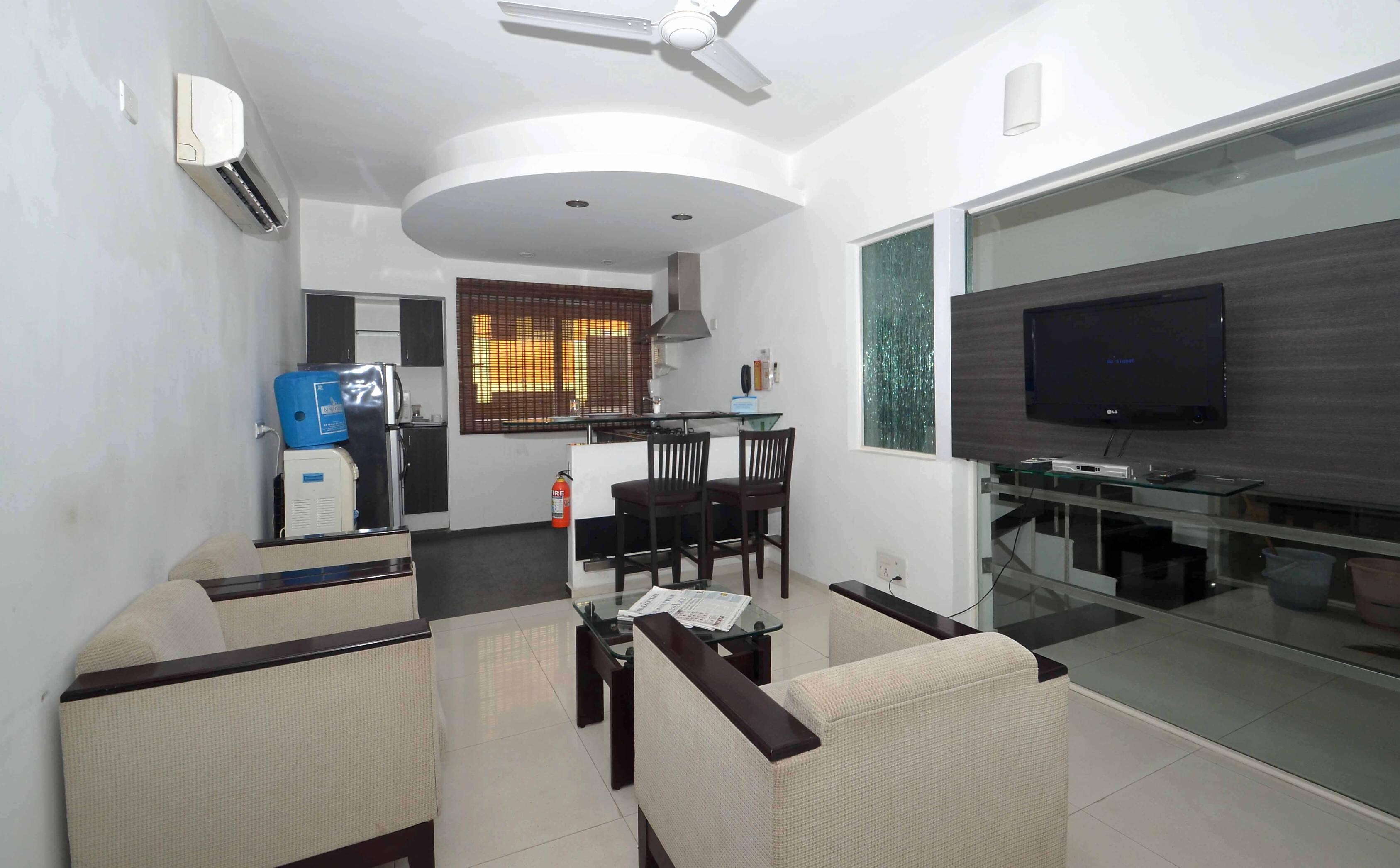 TrustedStay Dhanya Gardens - Tap to explore photos