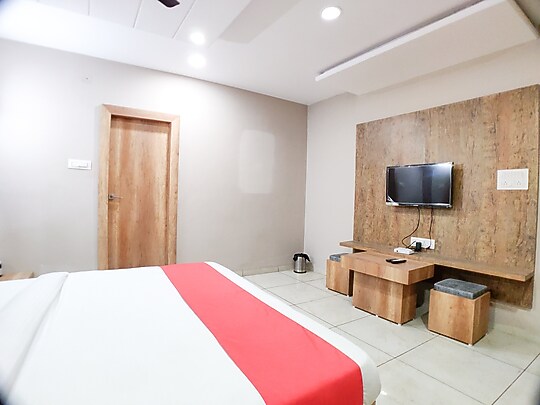 Deluxe Room Seating Hotel Grand Stay