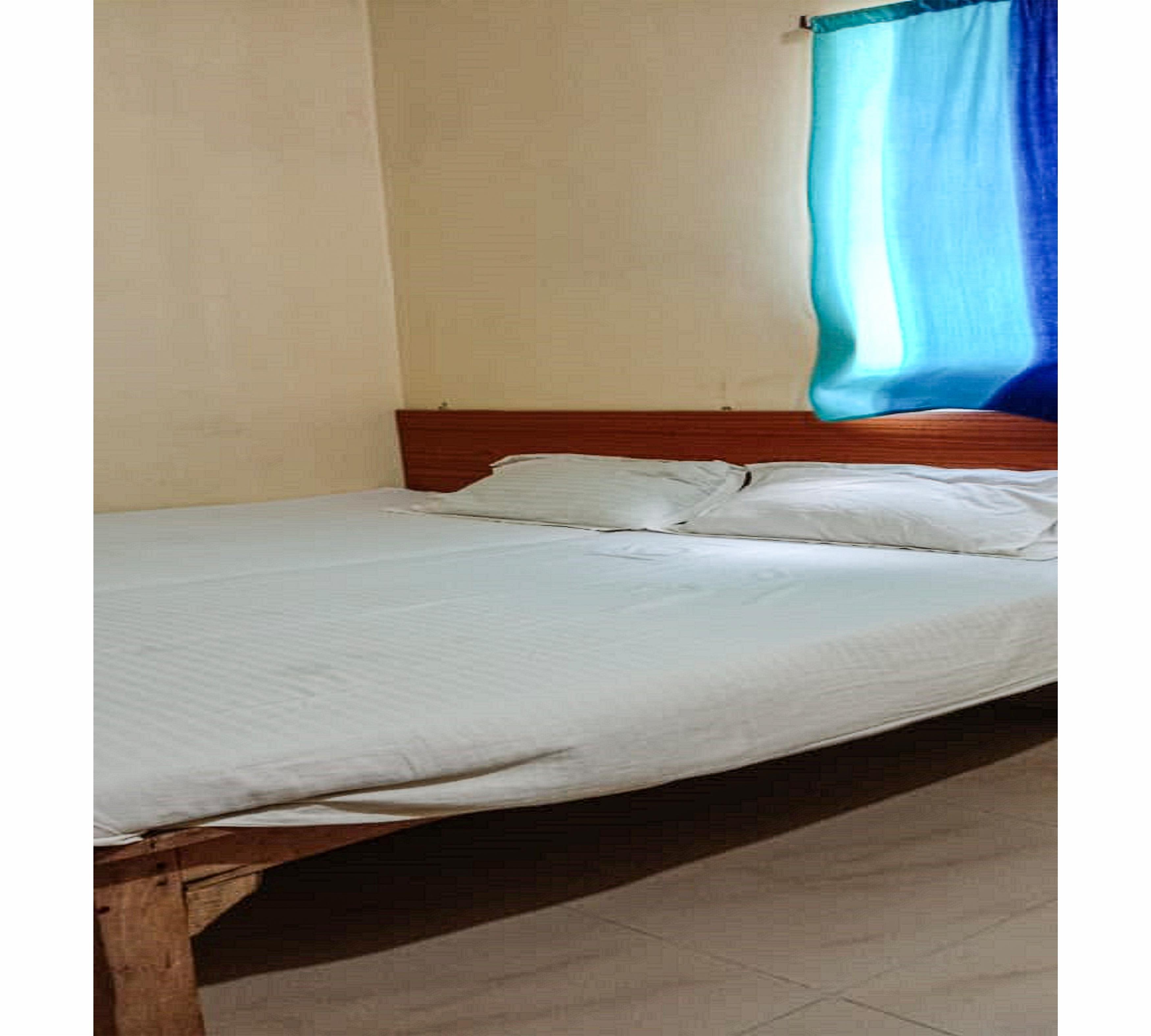 Puja Guest House By WB Inn - Tap to explore photos