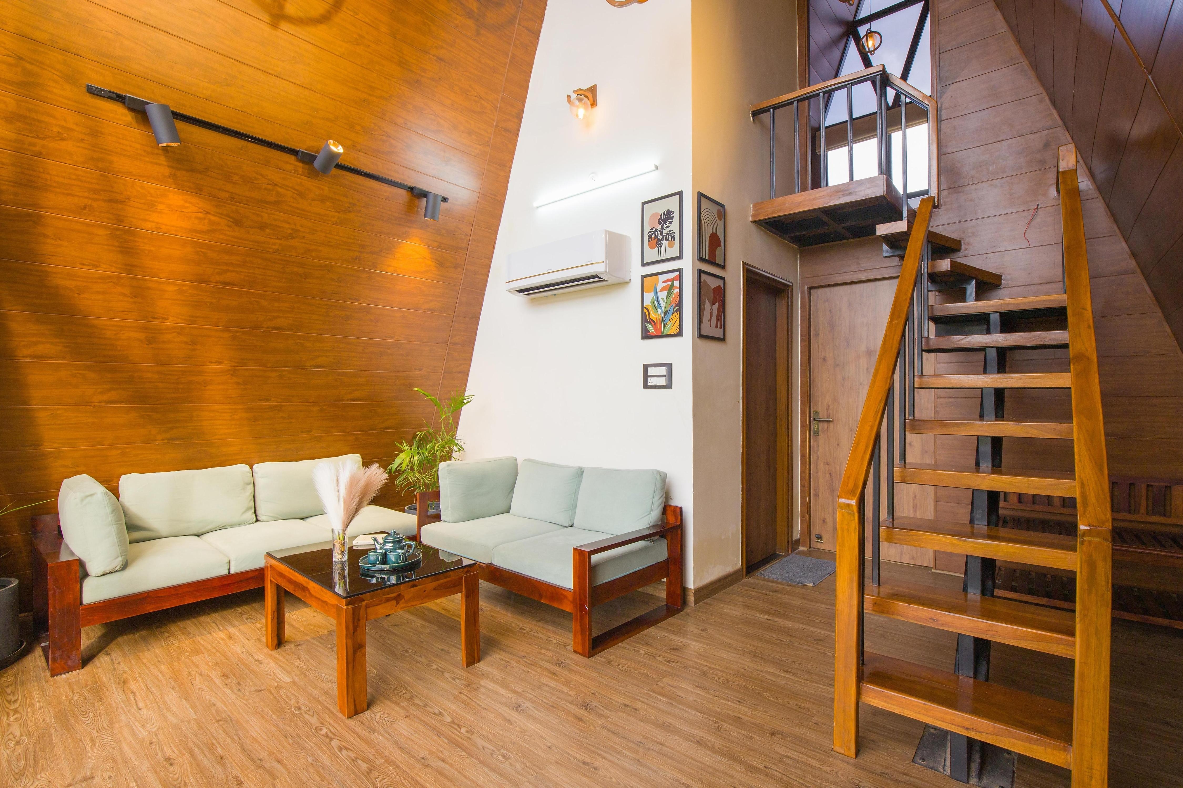 ELIVAAS 4 BHK Pvt Pool & Party Hall | Oakwood Cottages - Tap to explore photos