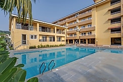 tisyastays | Pink Door 1BHK Apartment with Pool & Gym , Close to beach, Goa