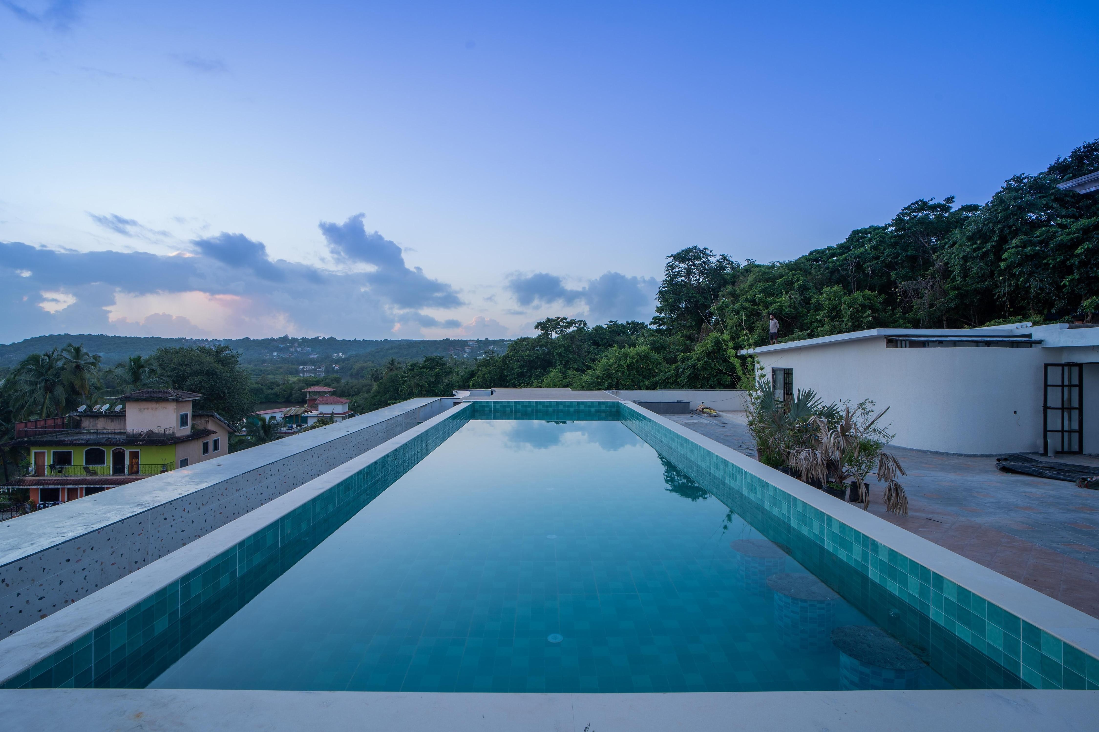 ELIVAAS Kamerios 1 BHK Apartments with shared Rooftop Pool - Tap to explore photos