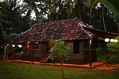 Whispering Waters | An Authentic Kerala Wood House, Calicut (Kozhikode)