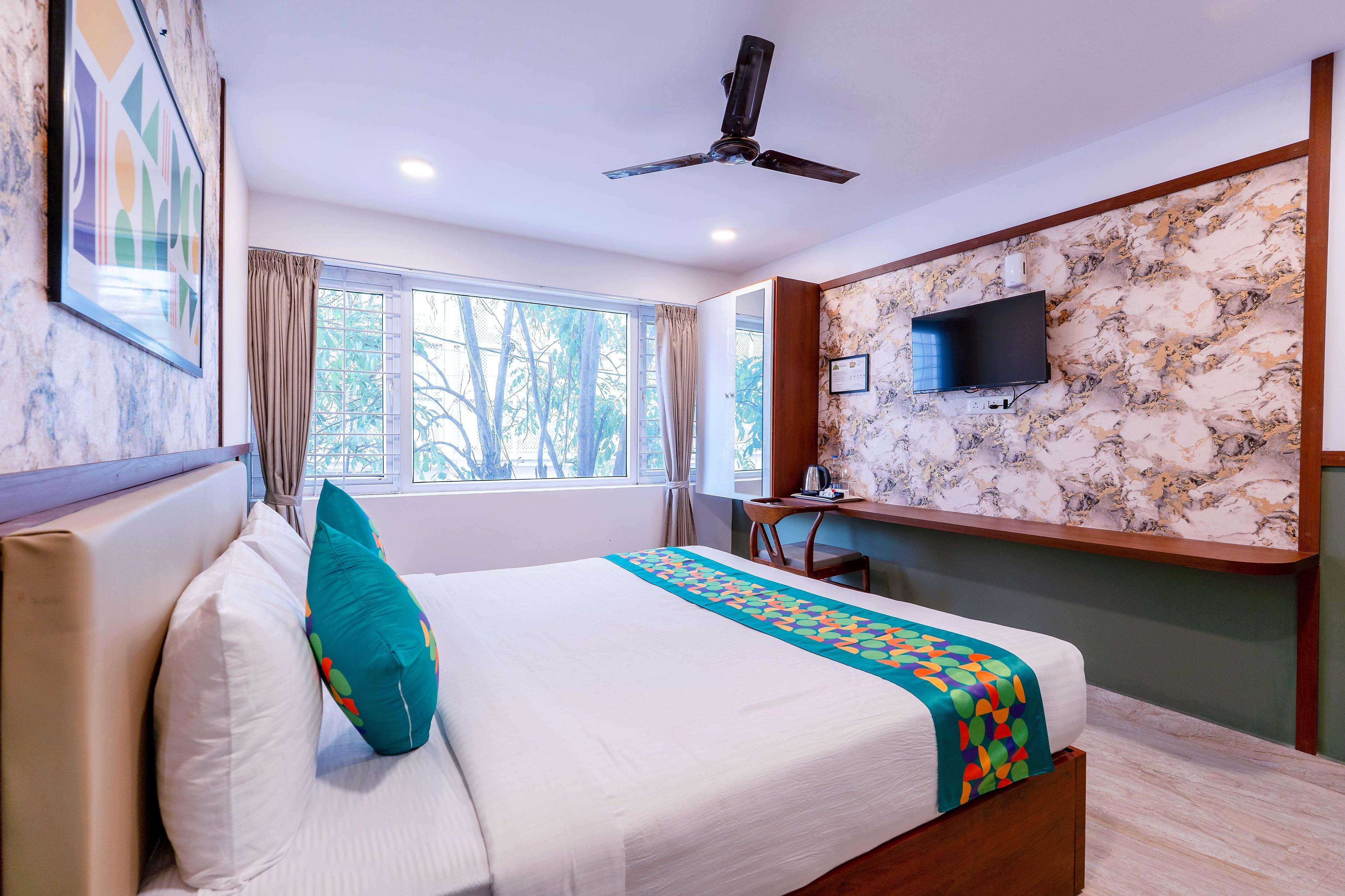 Treebo Emirates Suites Indiranagar - Tap to explore photos