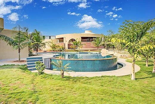 ELIVAAS Urvi Resort | Eco-Luxury Getaway with Pool, Garden & Game Zone