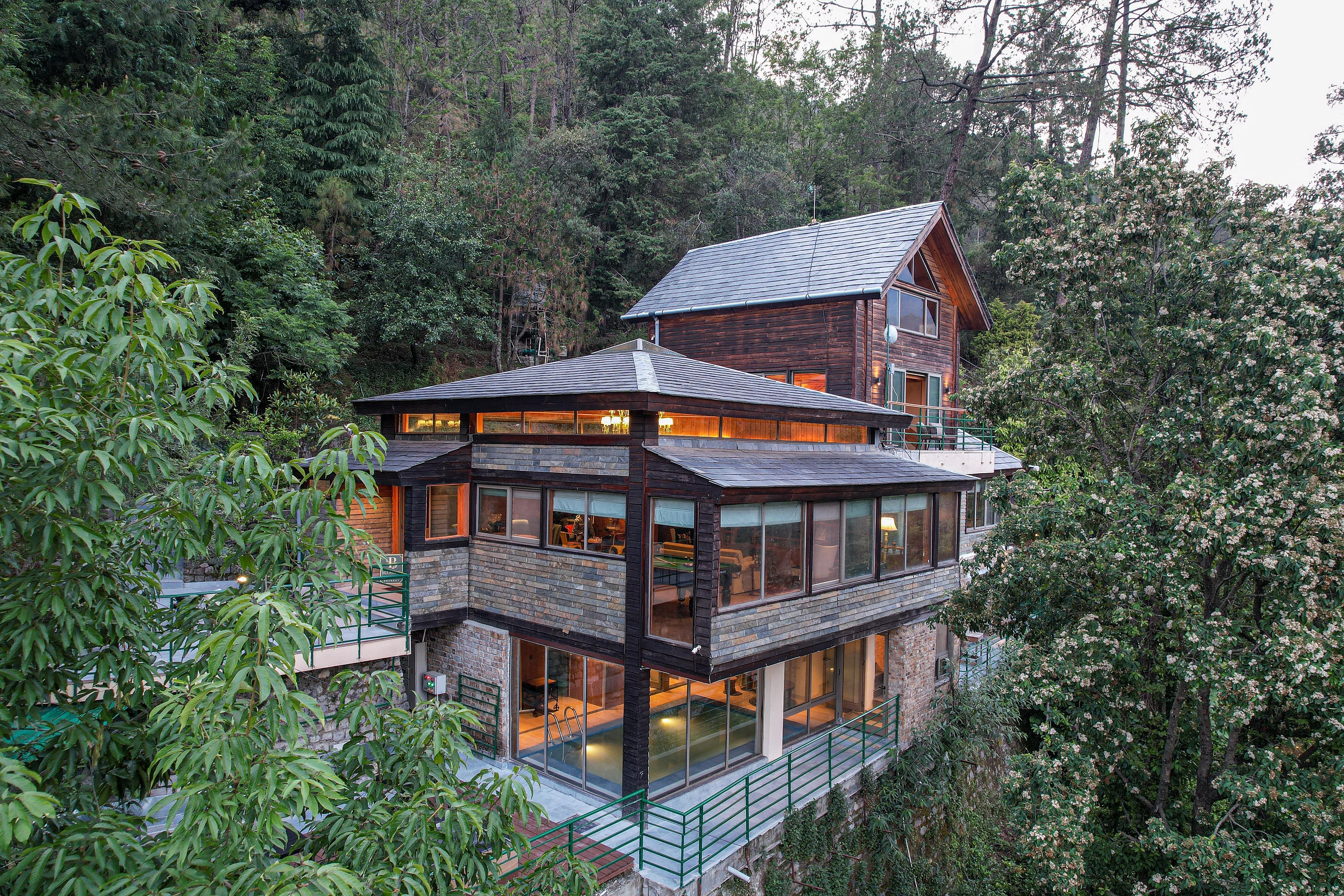 ELIVAAS Signature Blushing Pines Retreat Stunning 3-BHK Hillside Getaway with Attic & Indoor Pool - Tap to explore photos