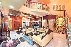 Wooden Whispers - A Luxe Traditional Spacez Villa with Private Theatre & Terrace, Bangalore