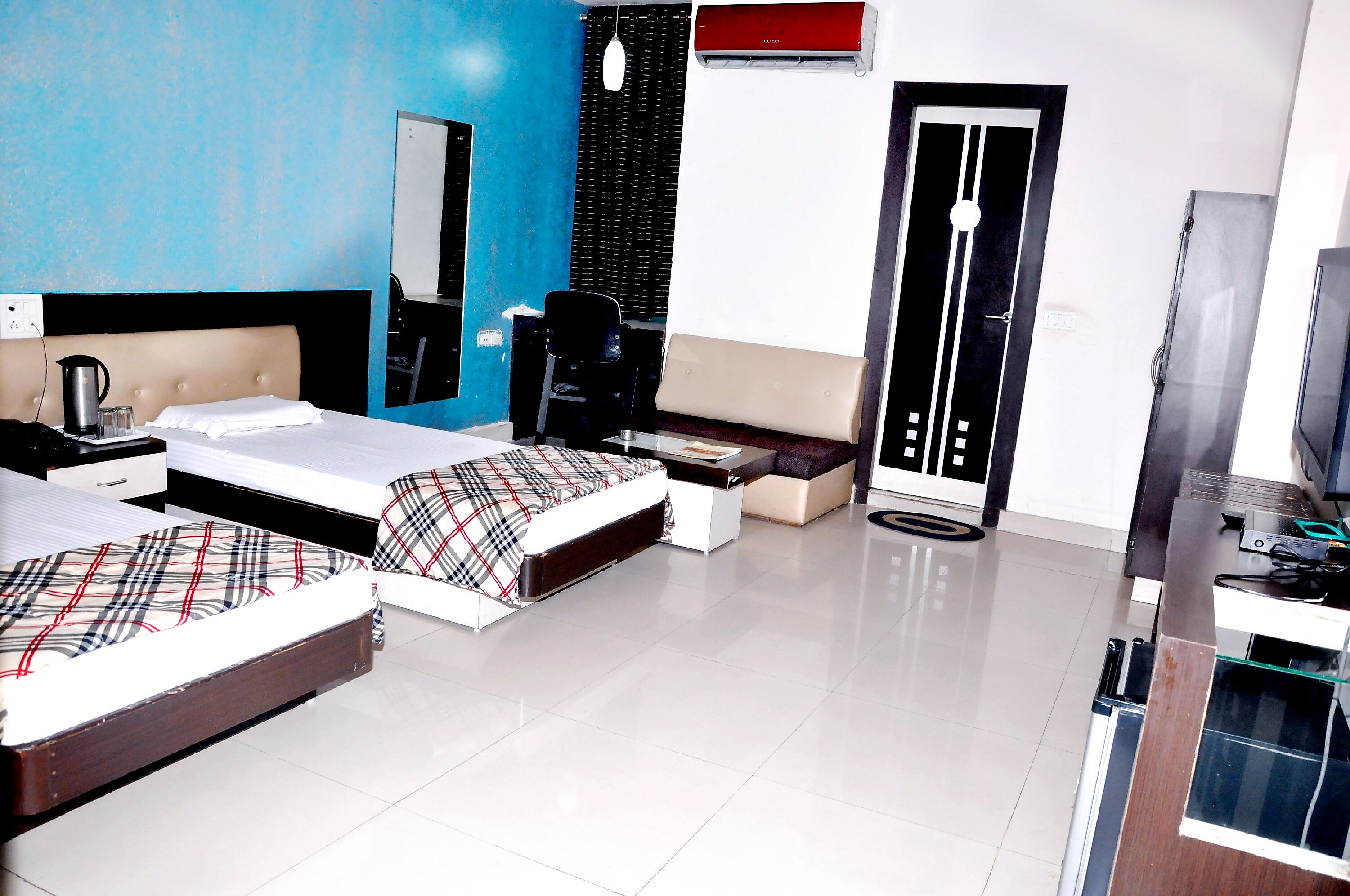 Hotel Om Residency - Tap to explore photos