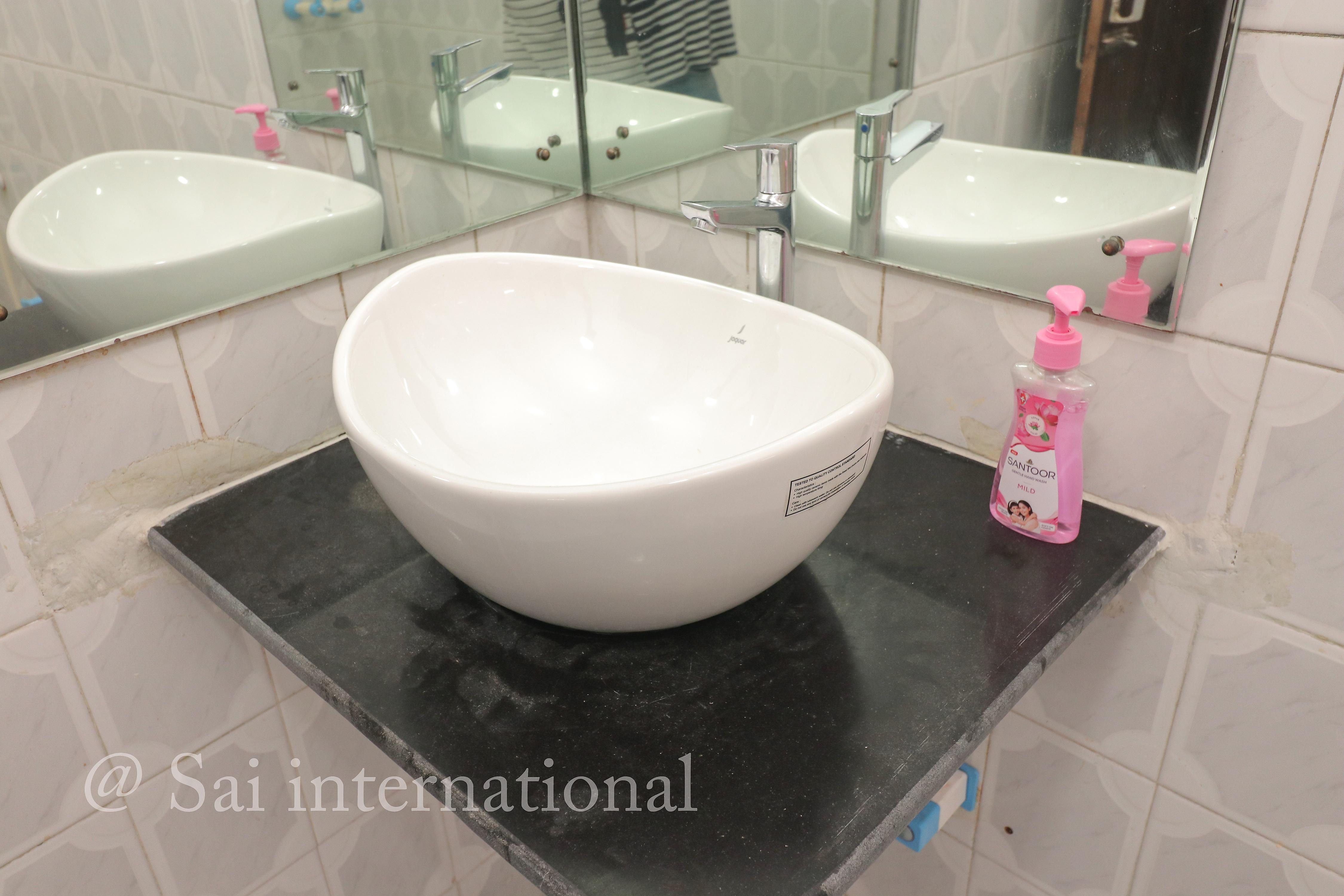 Sai International Guest House - Tap to explore photos