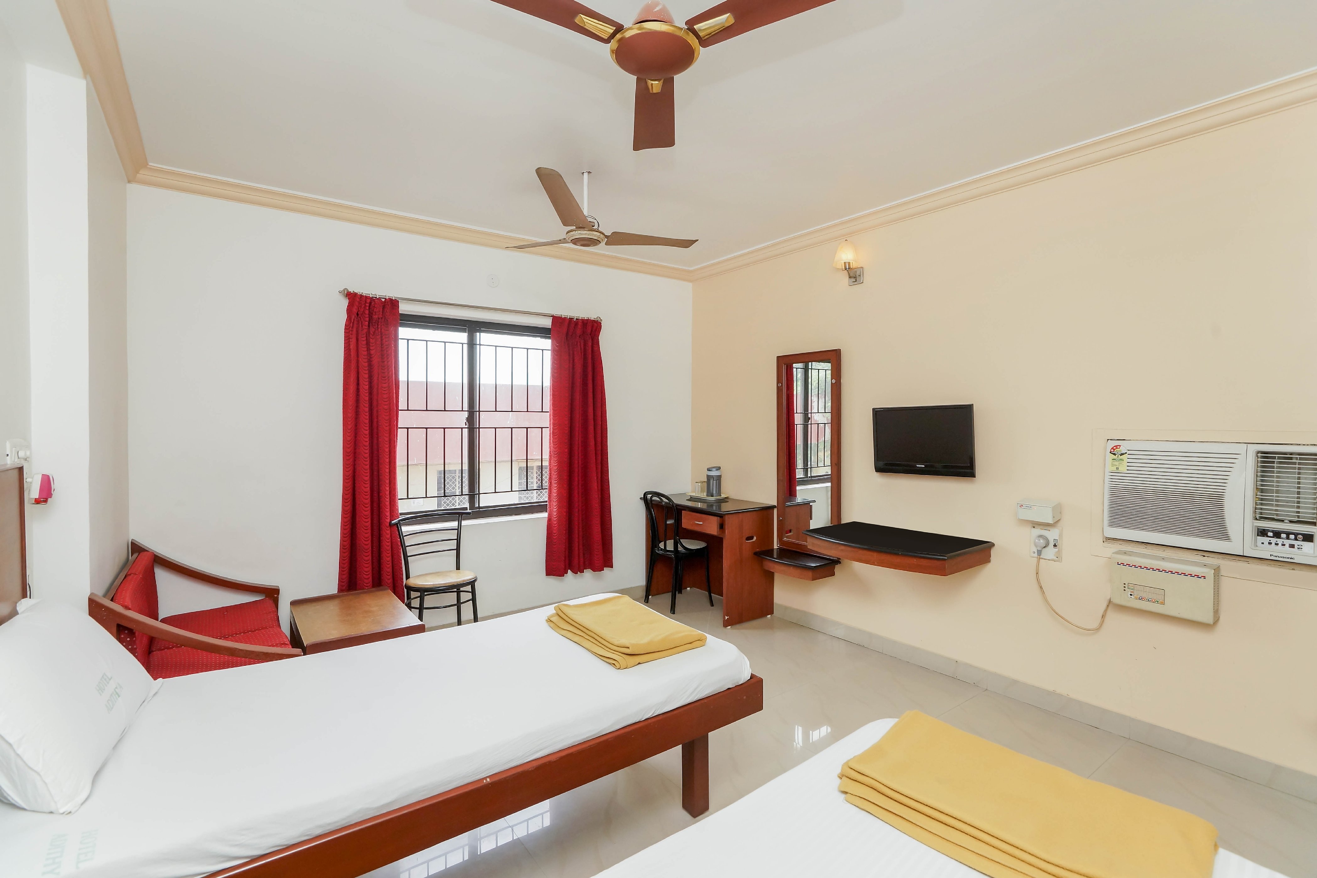 HOTEL ADITHYA  PERIAMET - Tap to explore photos