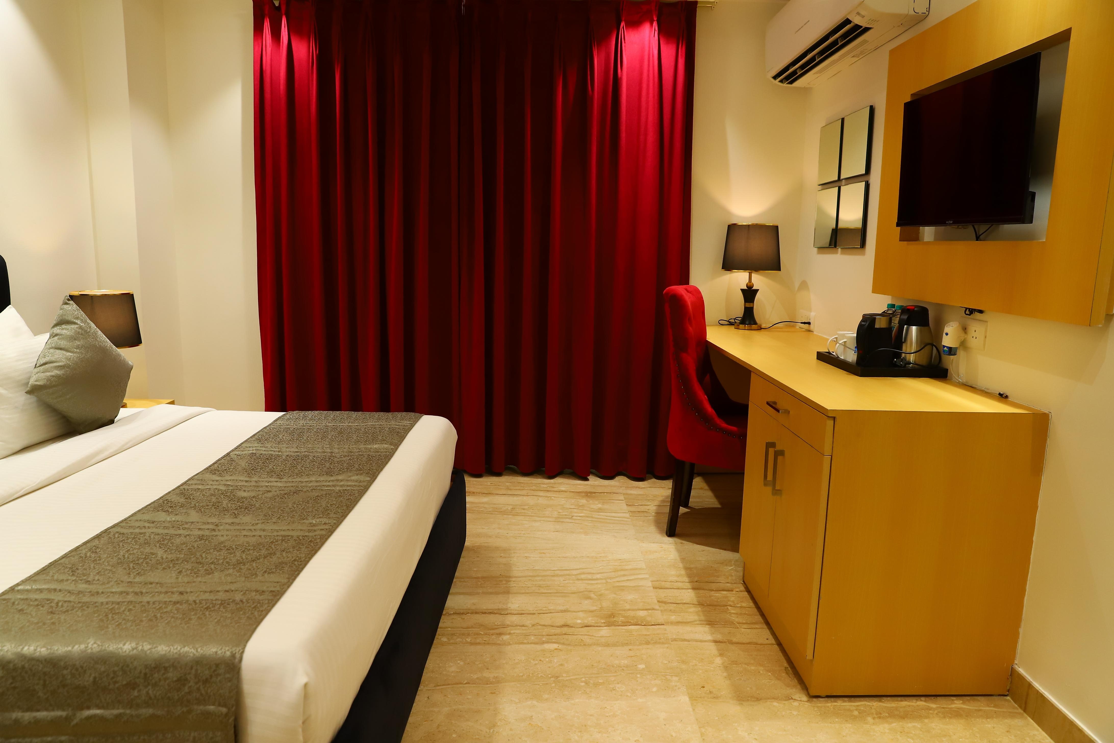 Hotel Malbork Inn @ Rajouri Garden, Delhi - Tap to explore photos
