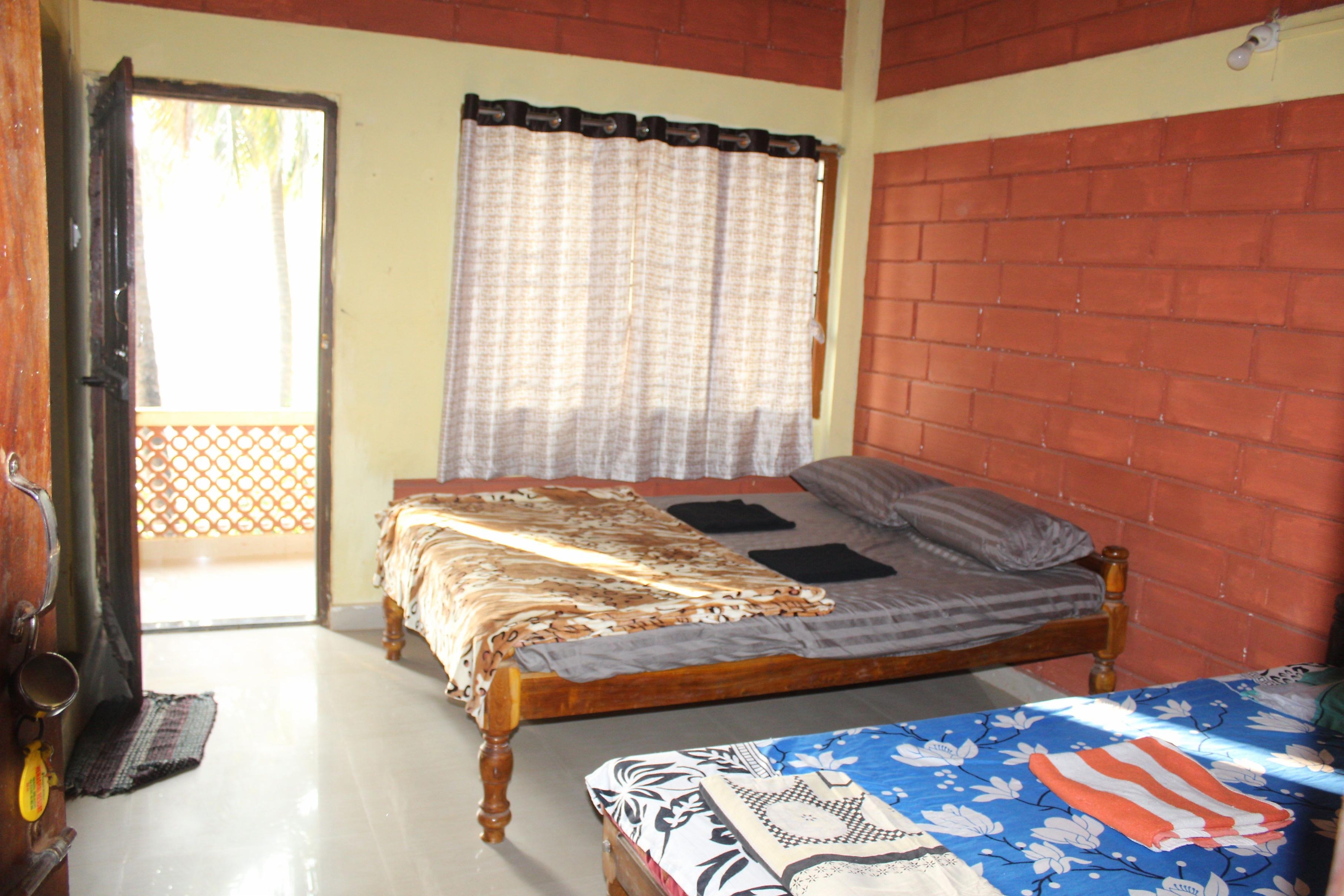 Surya Guest House, Gokarna - Tap to explore photos