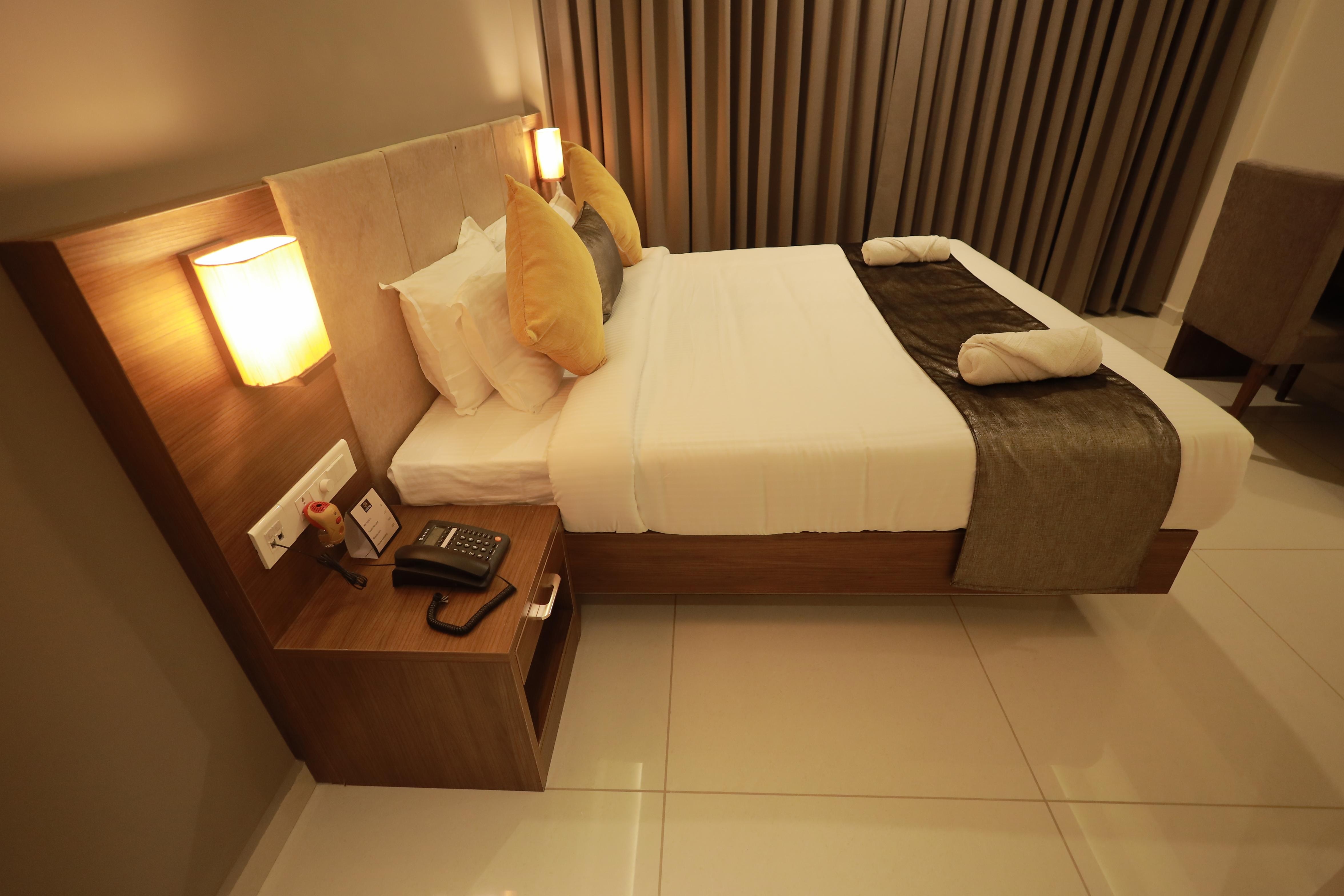 Hotel Kottayam Grand - Tap to explore photos