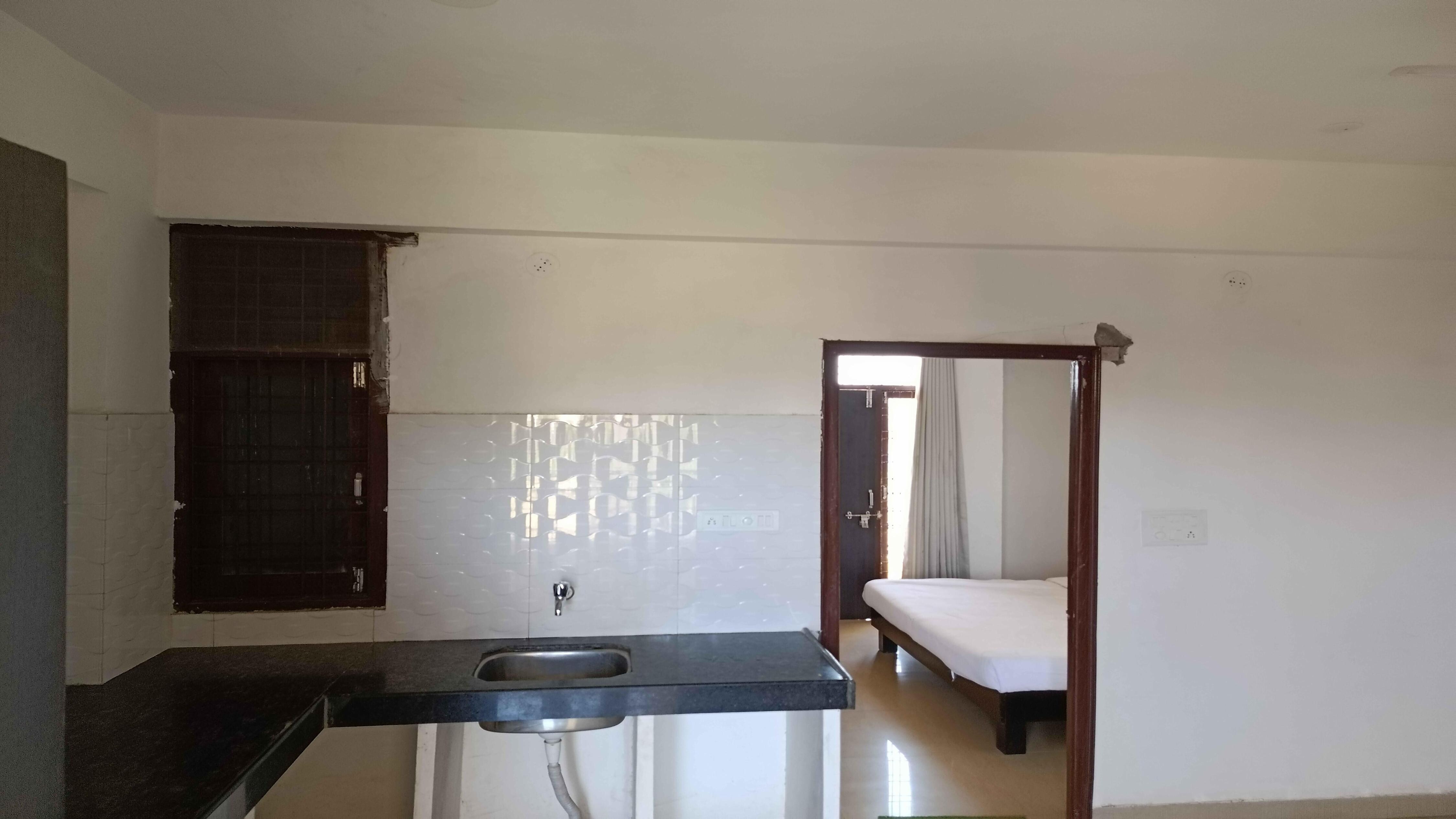 Janardan Studio Hotel - Tap to explore photos