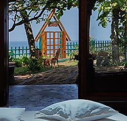 Main room offers luxury, while the second is cozy and slightly smaller, both with sea view.